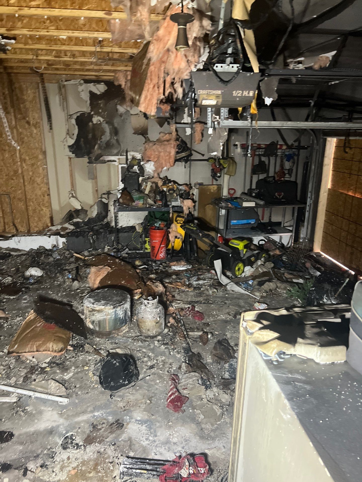 Extensive fire damage inside a Charleston garage cleared by IRS crew