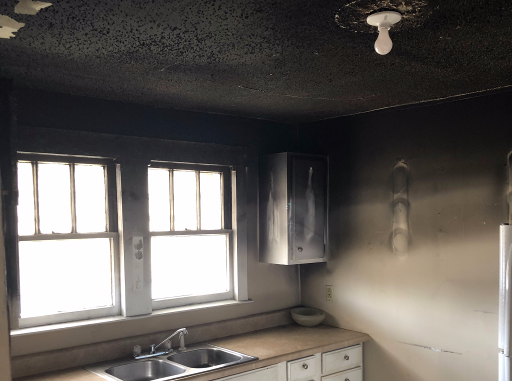 Heavy smoke and soot damage in a Charleston kitchen after a fire