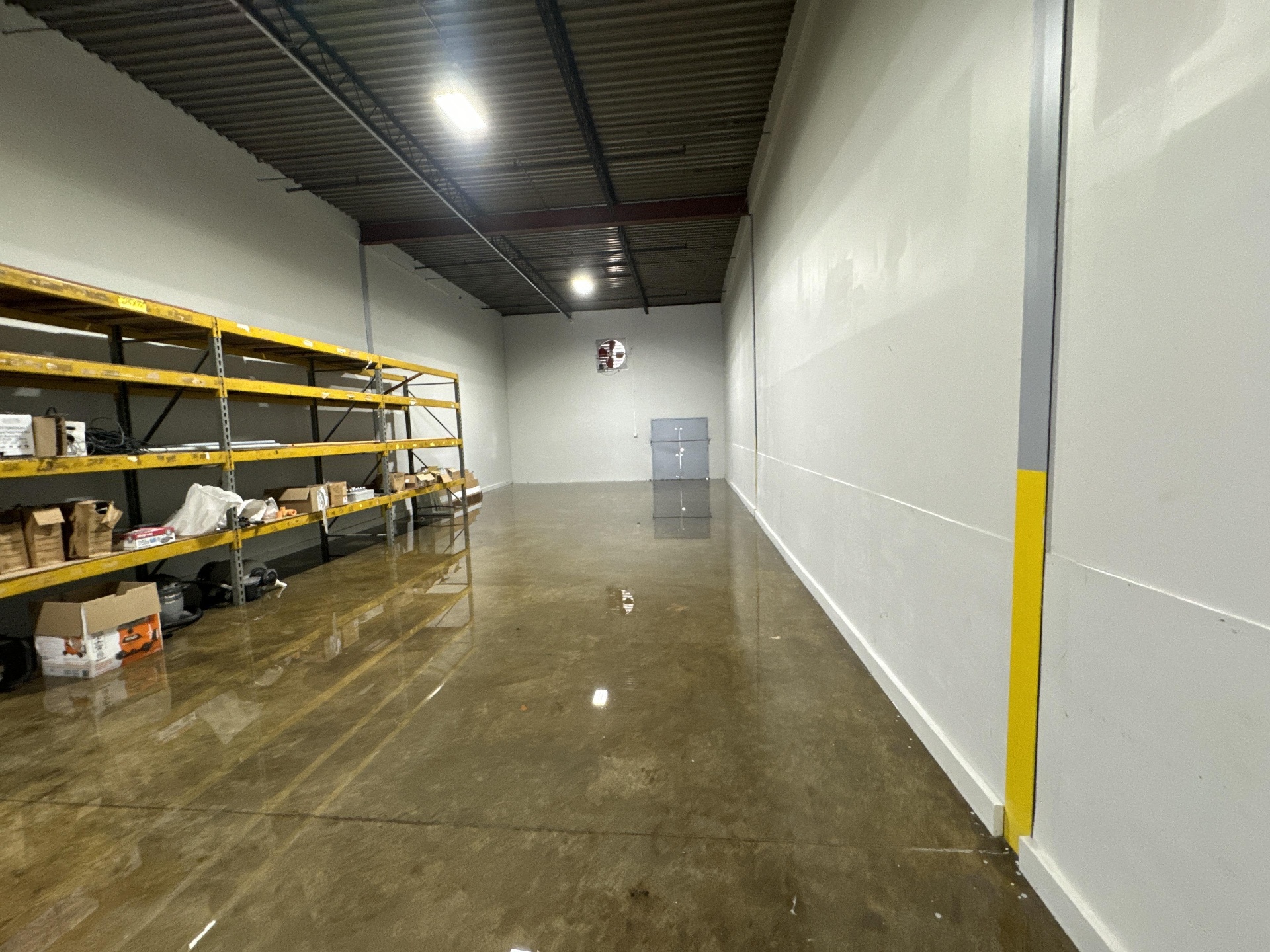 Flooded warehouse shelving with damaged inventory in Charleston